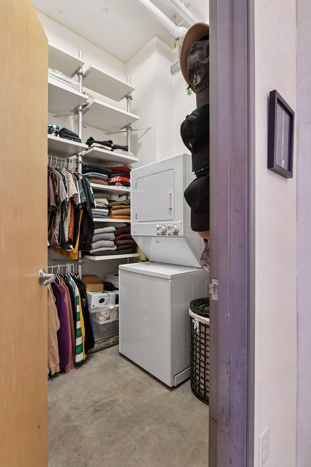 laundry room featuring stacked washer and clothes dryer