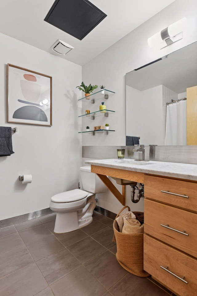 full bathroom with toilet, tile patterned floors, and baseboards