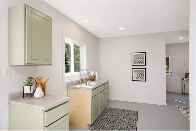 1808 Beach Dr SE, Forest Lake, MN 55025 - kitchen featuring a sink, green cabinets, light countertops, and recessed lighting