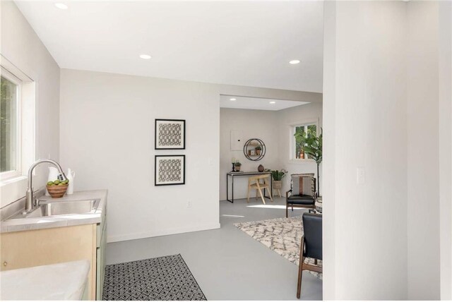 1808 Beach Dr SE, Forest Lake, MN 55025 - bathroom featuring a sink, concrete flooring, and recessed lighting