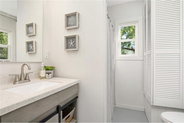 1808 Beach Dr SE, Forest Lake, MN 55025 - full bath featuring plenty of natural light, toilet, and vanity