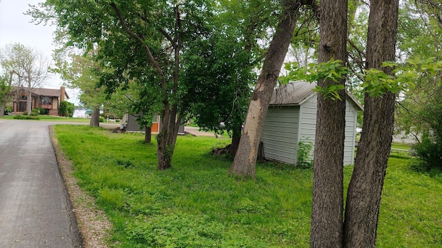 1808 Beach Dr SE, Forest Lake, MN 55025 - view of grassy yard featuring an outbuilding