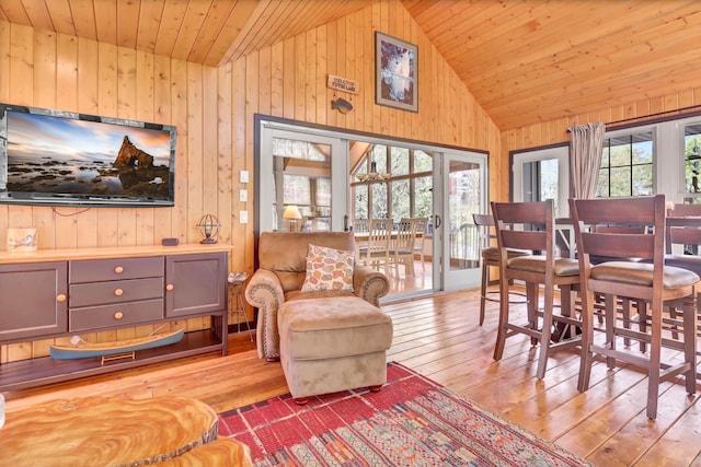 19336 Koetter Ct, Richmond, MN 56368 - dining area with vaulted ceiling, wood walls, wooden ceiling, and hardwood / wood-style flooring