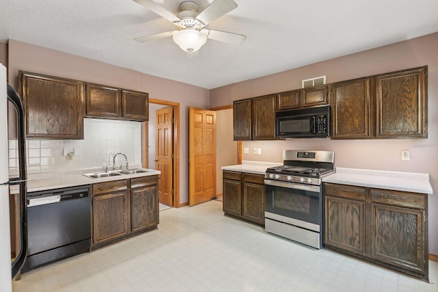 716 4th St NE, Minneapolis, MN 55413 - kitchen with black appliances, a sink, dark brown cabinetry, and light countertops