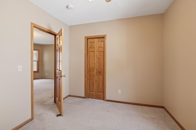 716 4th St NE, Minneapolis, MN 55413 - empty room with light colored carpet, baseboards, and a smoke detector