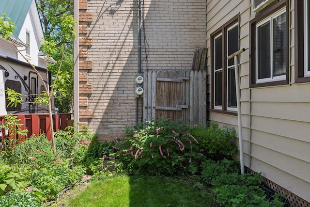 716 4th St NE, Minneapolis, MN 55413 - view of property exterior with brick siding and fence