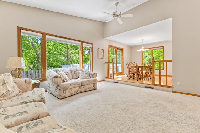 9553 Woodridge Cir, Eden Prairie, MN 55347 - living area with carpet, a ceiling fan, baseboards, and a chandelier
