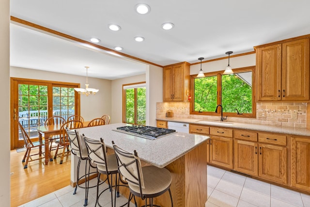 9553 Woodridge Cir, Eden Prairie, MN 55347 - kitchen with a sink, dishwasher, recessed lighting, a breakfast bar area, and tasteful backsplash