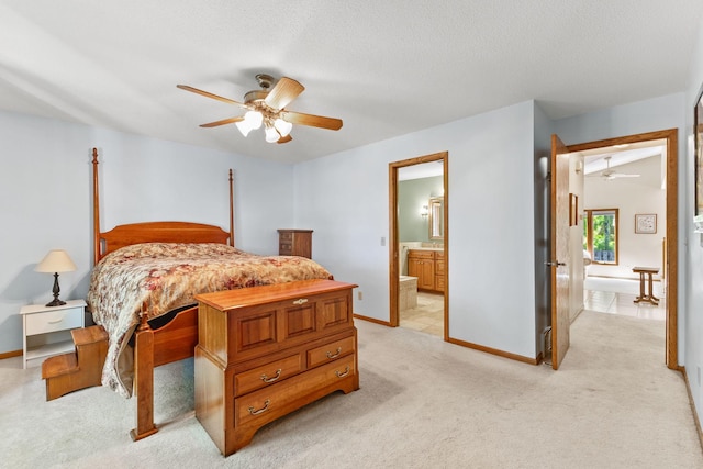9553 Woodridge Cir, Eden Prairie, MN 55347 - bedroom featuring light carpet, baseboards, connected bathroom, and a ceiling fan