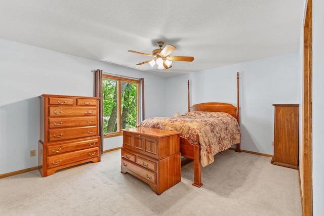 9553 Woodridge Cir, Eden Prairie, MN 55347 - bedroom with light carpet, a ceiling fan, baseboards, and a textured ceiling