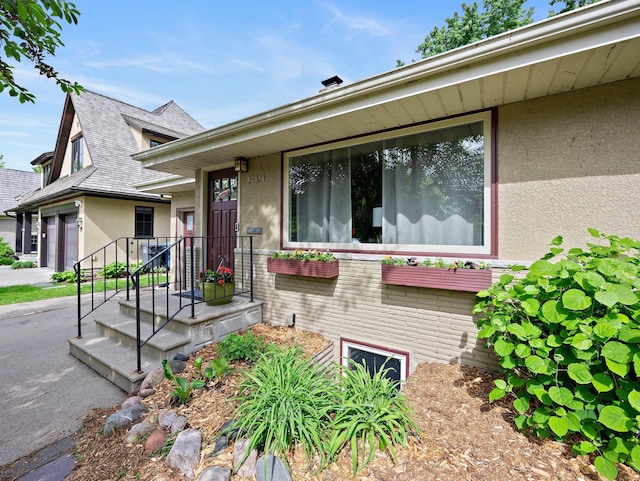 2532 Upton Ave S, Minneapolis, MN 55405 - view of front of property with stucco siding and a shingled roof