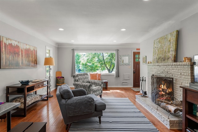 2532 Upton Ave S, Minneapolis, MN 55405 - living area with a brick fireplace, light wood-style flooring, recessed lighting, and baseboards