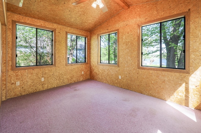 carpeted spare room featuring a ceiling fan