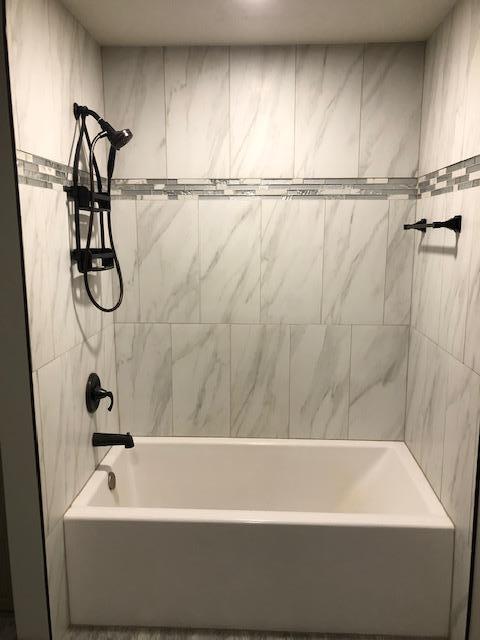 bathroom featuring bathing tub / shower combination