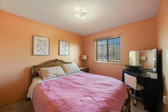 carpeted bedroom with a textured ceiling