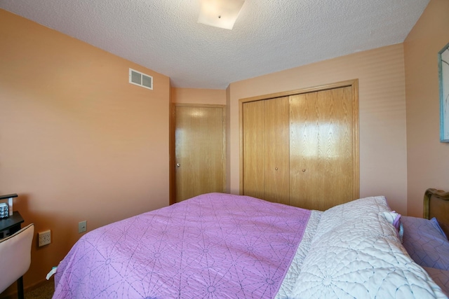 bedroom featuring a closet and a textured ceiling