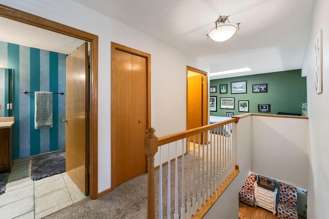 corridor featuring an upstairs landing