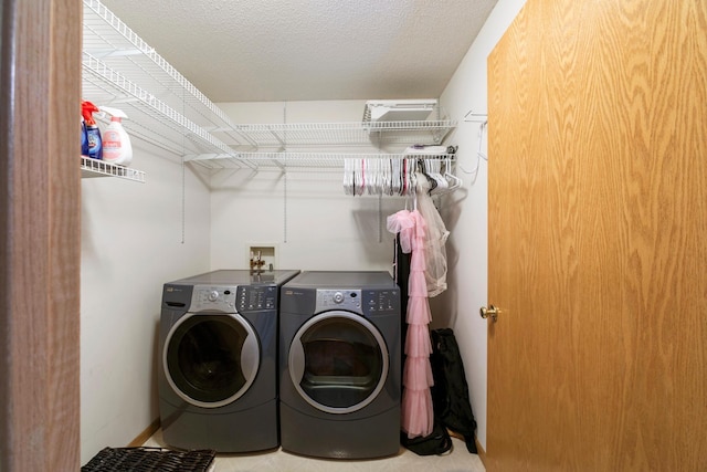 clothes washing area featuring washing machine and dryer
