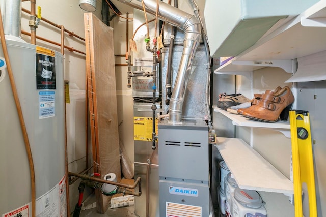 utility room featuring gas water heater