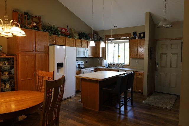 302 Pine St, Cannon Falls, MN 55009 - kitchen with white appliances, vaulted ceiling, light countertops, a kitchen island, and a chandelier