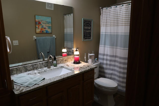 302 Pine St, Cannon Falls, MN 55009 - bathroom featuring toilet, vanity, and curtained shower