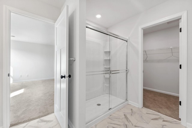 20104 78th Pl, Corcoran, MN 55340 - bathroom featuring marble finish floors, a stall shower, a spacious closet, and recessed lighting