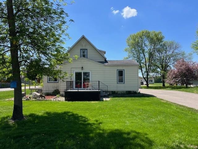 400 Main St W, Morristown, MN 55052 - rear view of property featuring a lawn