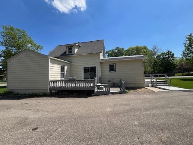 400 Main St W, Morristown, MN 55052 - back of property with a wooden deck