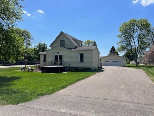 400 Main St W, Morristown, MN 55052 - view of front of home with an outbuilding, a garage, and a front lawn
