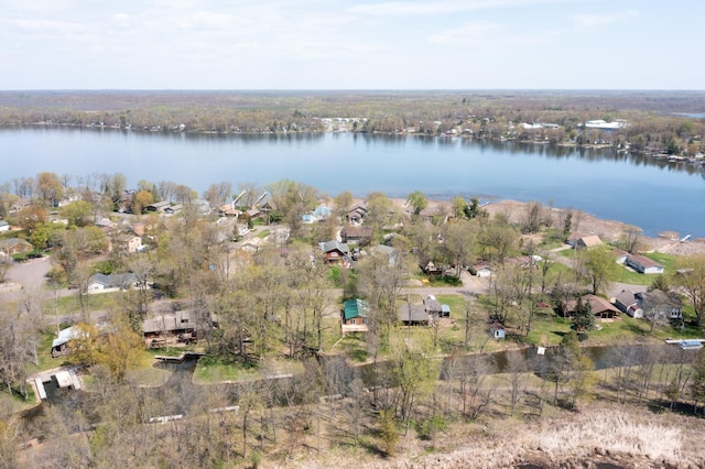aerial overview of property's location with a nearby body of water and nearby suburban area