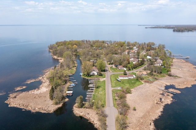aerial view of property's location with a large body of water