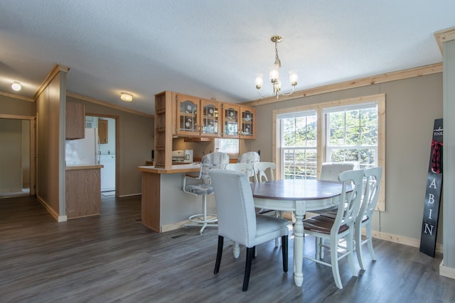 dining area with crown molding, a chandelier, dark wood finished floors, and baseboards