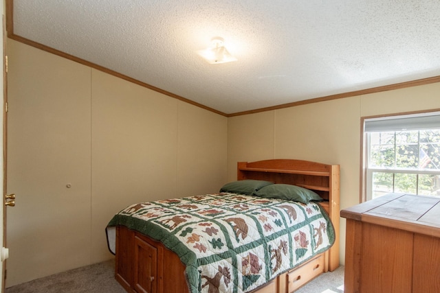 carpeted bedroom with crown molding, a textured ceiling, and vaulted ceiling