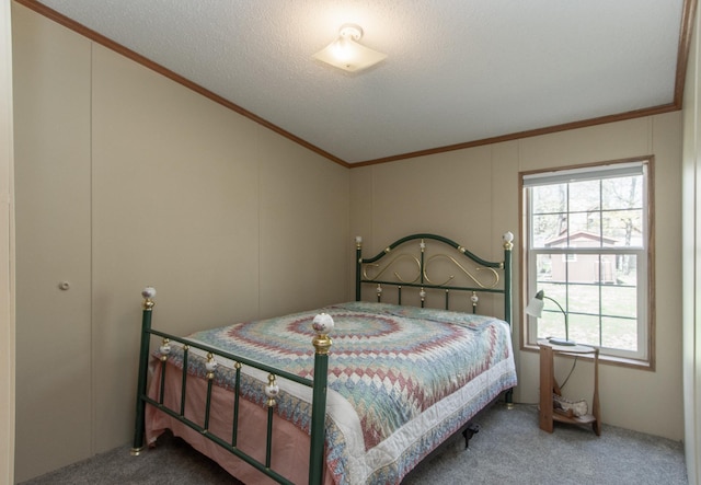 carpeted bedroom with crown molding, lofted ceiling, and a decorative wall