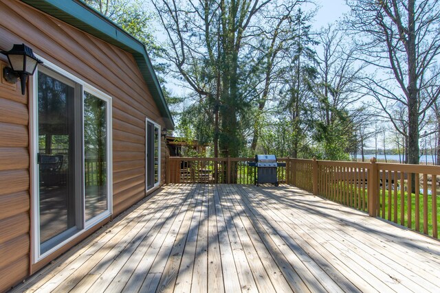 wooden terrace with a water view