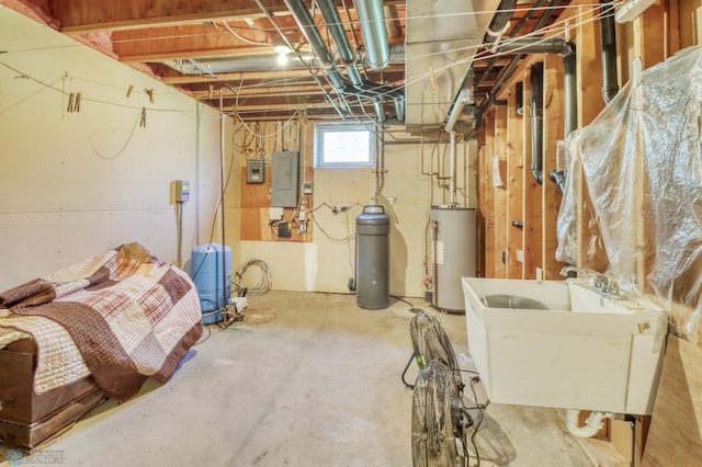 basement featuring gas water heater, a water pressure tank, electric panel, a sink, and a water softener