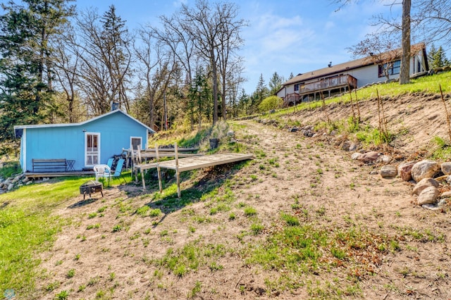 view of yard featuring a wooden deck