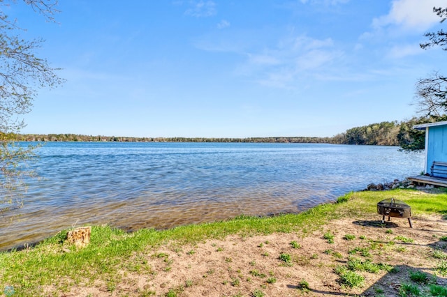 water view with a fire pit