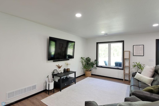 14840 Eaglewood Dr, Burlington Twp, MN 56501 - living area featuring wood finished floors, recessed lighting, and baseboards