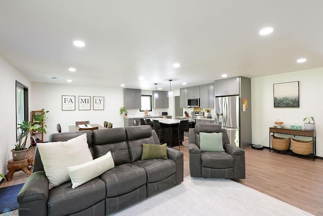 14840 Eaglewood Dr, Burlington Twp, MN 56501 - living area featuring recessed lighting, light wood-style flooring, and plenty of natural light