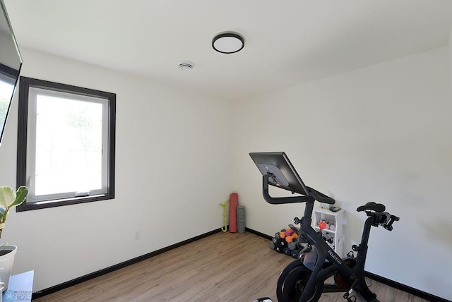 14840 Eaglewood Dr, Burlington Twp, MN 56501 - workout room with light wood-type flooring and baseboards