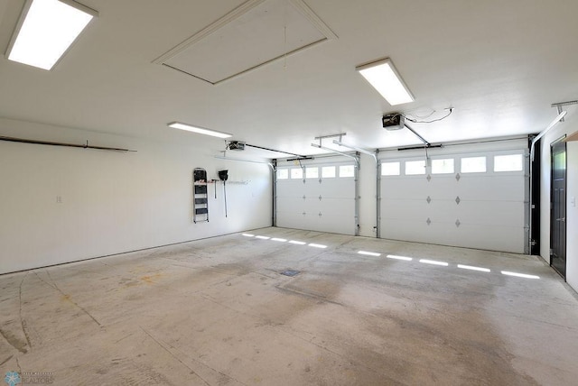 14840 Eaglewood Dr, Burlington Twp, MN 56501 - garage featuring a garage door opener