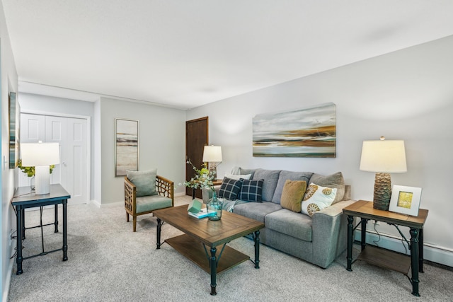 living area featuring light carpet and baseboards