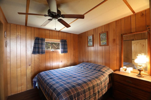 3291 Thomas Rd, Greenwood Twp, MN 55790 - bedroom featuring wooden walls and ceiling fan