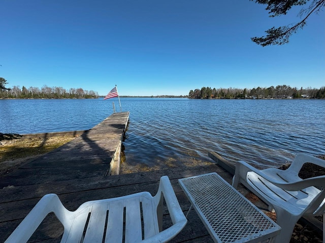 3291 Thomas Rd, Greenwood Twp, MN 55790 - dock featuring a water view and a boat ramp