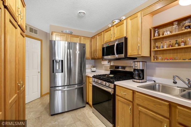 1785 Riverwood Dr, Burnsville, MN 55337 - kitchen featuring appliances with stainless steel finishes, a sink, light countertops, and open shelves