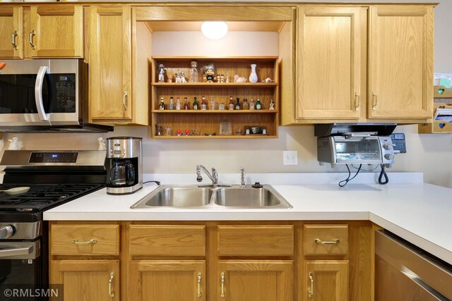 1785 Riverwood Dr, Burnsville, MN 55337 - kitchen with appliances with stainless steel finishes, a sink, and light countertops