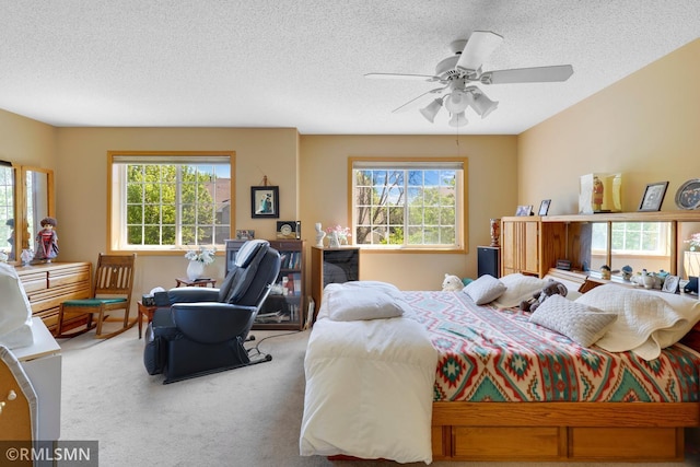 1785 Riverwood Dr, Burnsville, MN 55337 - bedroom with a textured ceiling, carpet flooring, and ceiling fan