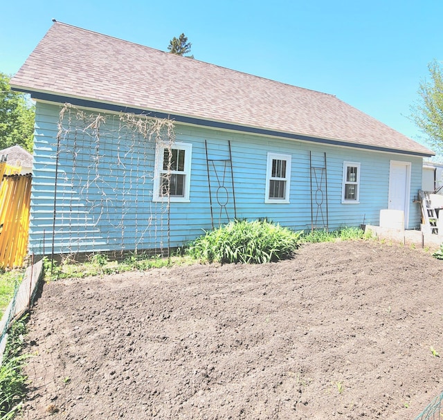 21 3rd St E, Ada, MN 56510 - rear view of property with fence and roof with shingles
