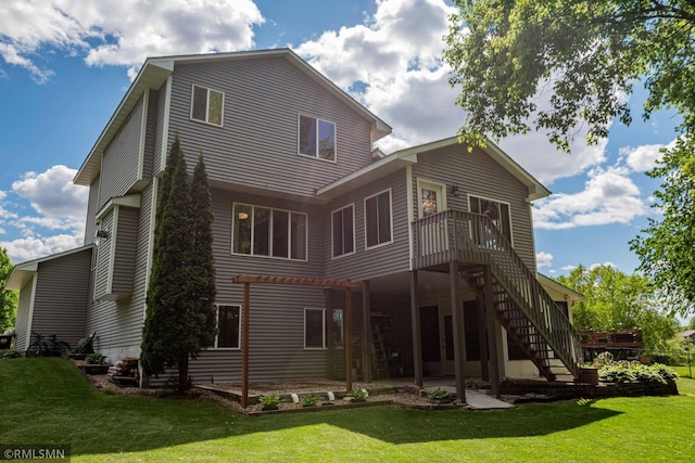 155 Palomino Ln, Lino Lakes, MN 55014 - back of house with stairway, a yard, and a deck